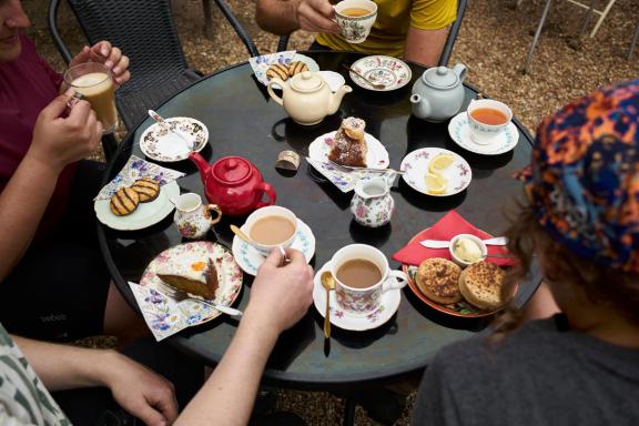 Cyclists enjoying coffee and cakes